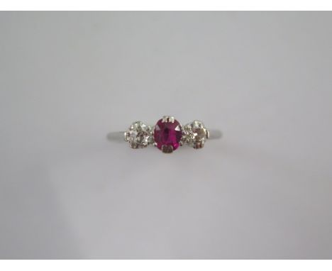 A platinum diamond and ruby type three stone ring size M - approx weight 2.7 grams - stones bright 