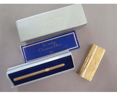 A Dunhill gold plated lighter with damage flint holder and a Christian Dior pen case - Length 9.5cm - boxed 