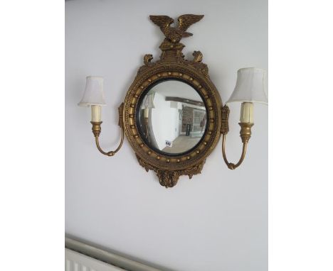 A Georgian style gilt girondale wood wall mirror with two side lights 