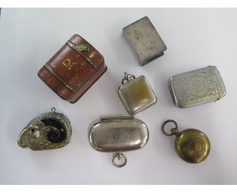 Three base metal coin cases, a plated vesta, a Rams head vesta and a plated matchbox case and miniature trunk 