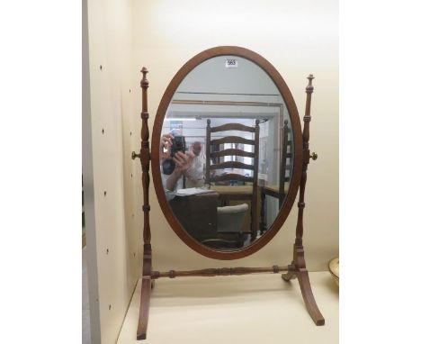 A mahogany oval dressing mirror on stand - Height 69cm x Width 49cm 
