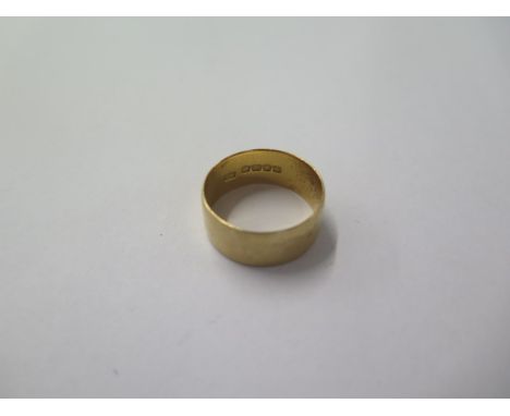 An 18ct gold band ring size R - approx weight 6.2 grams 