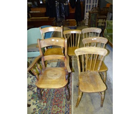 Two elm and beech lathe-back armchairs, a walnut spindle-back tub chair and four stick-back chairs, (7). 