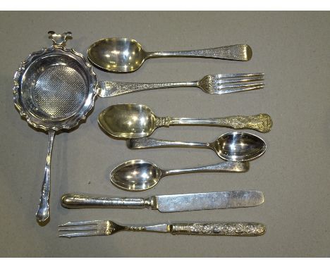 A silver bright-cut christening spoon and fork, London 1880, a white metal tea strainer and other small silver, weighable sil