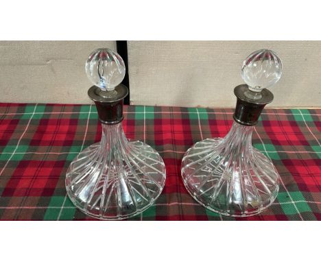  Sale Item:    2 SILVER COLLARED DECANTERS (1 STOPPER HAS SMALL CHIP-AF)  Vat Status:   No Vat   Buyers Premium:  This lot is