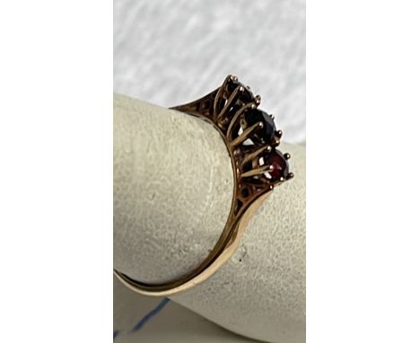  Sale Item:    9 CT GOLD 3 STONE GARNET RING SIZE N  Vat Status:   No Vat   Buyers Premium:  This lot is subject to a Buyers 
