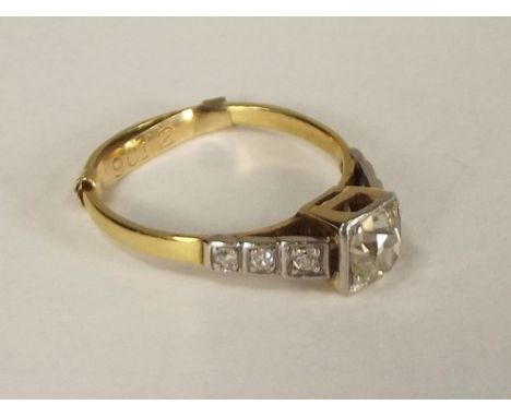 DIAMOND RING.
An 18ct. gold (marks rubbed) diamond set ring.