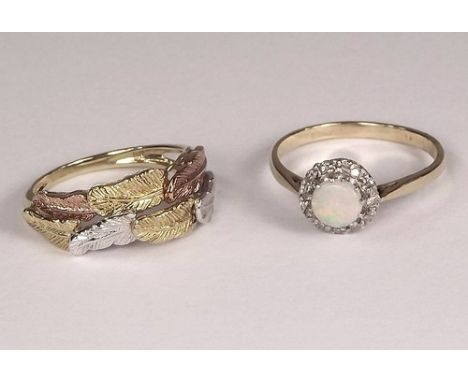 GOLD RINGS.
A 9ct. gold opal & diamond cluster ring & a yellow, white & rose gold leaf ring.