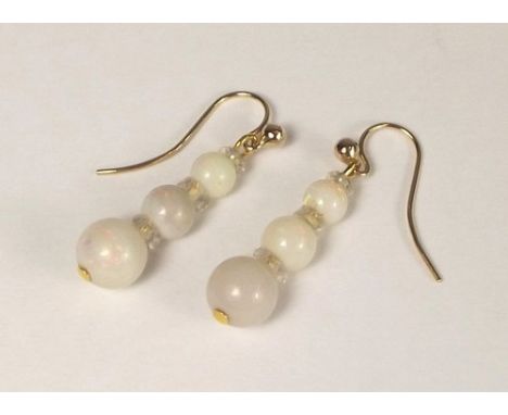 OPAL EARRINGS.
A pair of Edwardian, graduated opal & crystal bead earrings on 9ct. gold hooks.