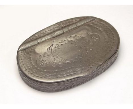 SNUFF BOX.
An early 19th century pewter snuff box with punched decoration.
5 x 7cm.