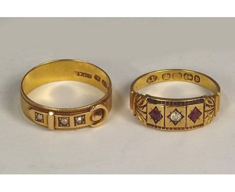 GOLD RINGS.
A Victorian diamond set strap & buckle ring & one other Victorian ruby & diamond ring. 