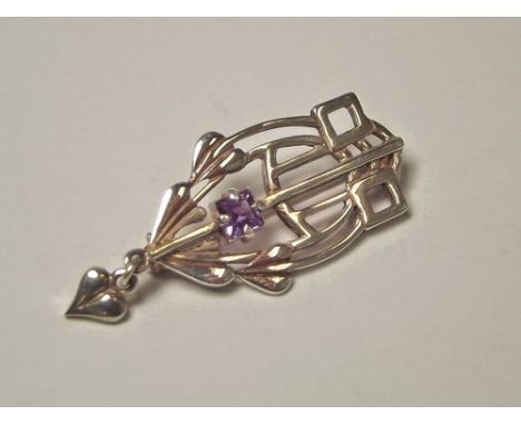 AMETHYST BROOCH.
A silver & amethyst brooch after Charles Rennie Mackintosh.