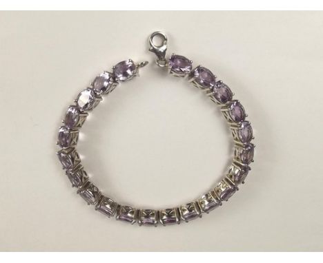 AMETHYST BRACELET.
A platinum plated silver, amethyst set bracelet.