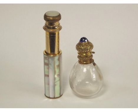SCENT BOTTLE ETC.
A brass mounted scent bottle & a French mother of pearl spring loaded atomiser by Teddy.