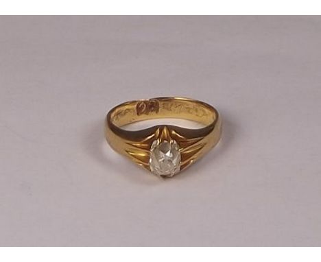 DIAMOND RING.
A 22ct. gold ring, set a cushion shaped, old cut diamond, of a slightly tinted colour. Approx. 1ct. Size N.