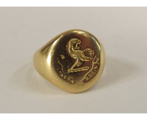 SIGNET RING.
An 18ct. gold signet ring, cast a demi lion rampant intaglio, with the motto "Fidus et Audax." (Faithful & coura