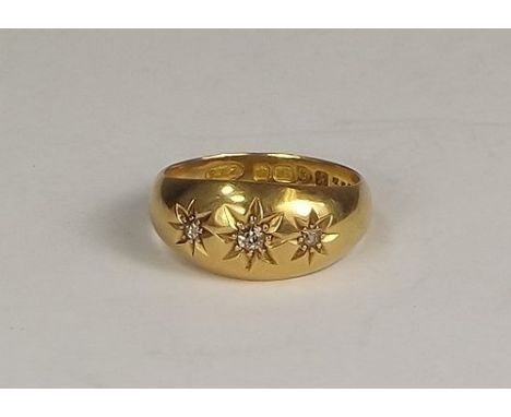 GOLD RING. 
An Edwardian, 18ct. gold three stone diamond ring.