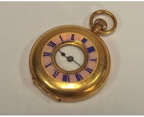 FOB WATCH.
An 18ct. gold half hunter small fob watch, with enamelled chapter ring, chipped.