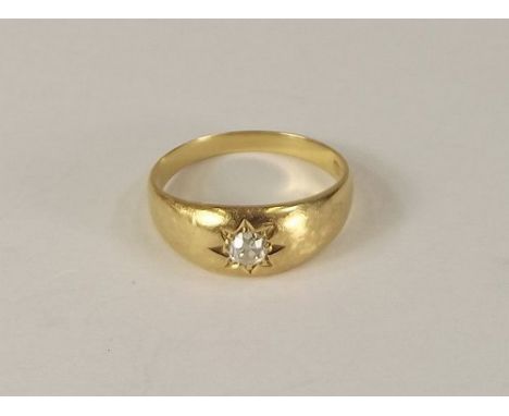 DIAMOND RING.
An 18ct. gold gypsy set solitaire diamond ring.