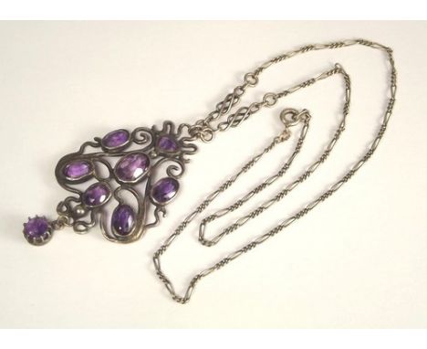 AMETHYST PENDANT.
A hand made Art Nouveau silver & amethyst pendant. Length of drop 5.5cm.