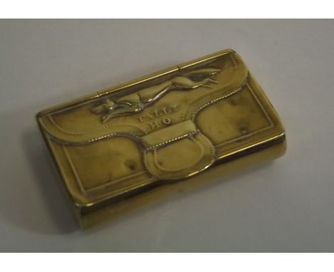 SNUFF BOX.
A Victorian brass snuff box, in the form of a case, the flap stamped with a fox and 'Tally Ho!'