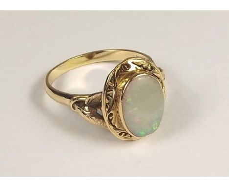 OPAL RING.
An 18ct. gold ring set an oval opal.
Size W/X.