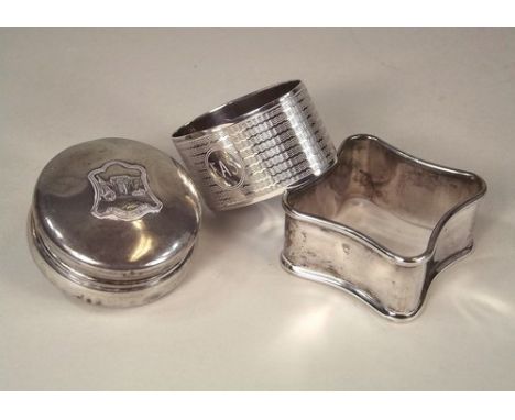 NAPKIN RING & BOX.
An engine turned silver napkin ring, a 1920's silver souvenir box & and EPNS napkin ring.