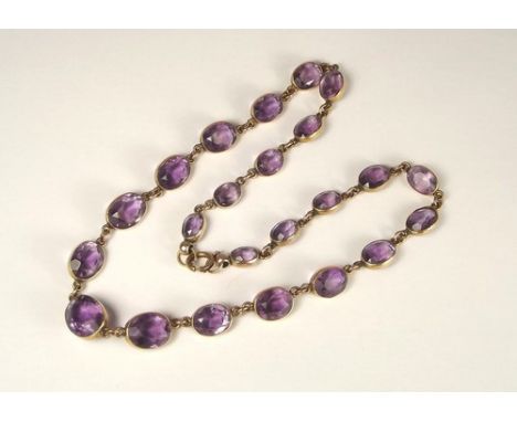 AMETHYST NECKLACE.
A yellow metal mounted, faceted amethyst necklace.