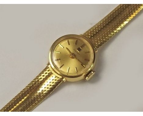 GOLD WATCH.
A lady's Tissot 18ct. gold cased wristwatch on integral strap. Total weight approx. 23.8g.