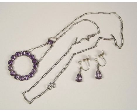 AMETHYST NECKLACE ETC.
A silver & amethyst necklace, drop 5cm. & a pair of amethyst set silver drop earrings.