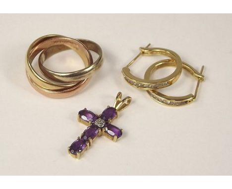 GOLD PENDANT ETC.
A 9ct. gold amethyst pendant, a 9ct. gold triple ring & a pair of 9ct. gold earrings.