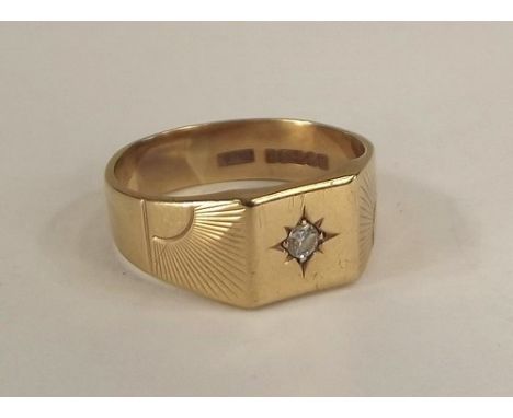 GOLD RING.
A gentleman's 9ct. gold diamond set ring. Approx. 5.8g.