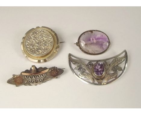 SILVER BROOCHES.
Two silver & amethyst brooches & two earlier silver brooches.