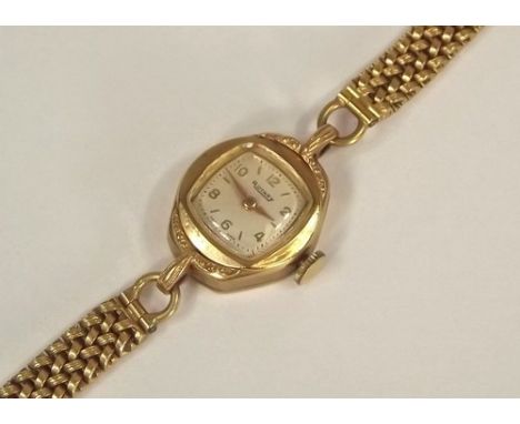 GOLD WATCH.
A Rotary 9ct. gold cased wristwatch & strap. Total weight approx. 18g. 