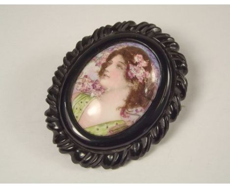 PORTRAIT BROOCH.
A Victorian porcelain plaque portrait brooch, in composition frame. 6 x 5cm.
