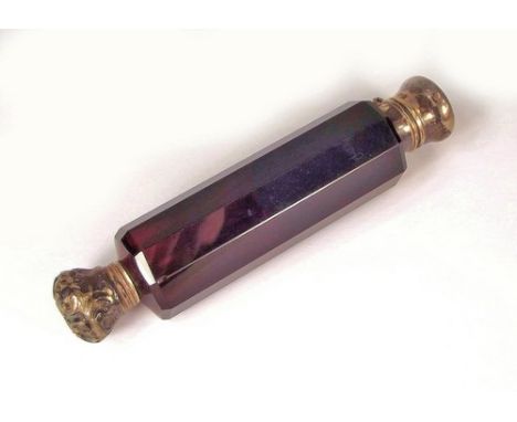 SCENT BOTTLE.
A Victorian silver mounted, double ended, ruby glass scent bottle. (screw top seized)