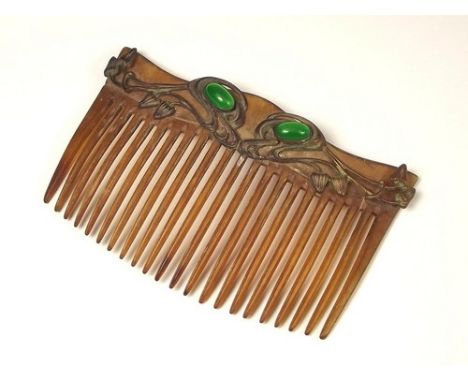 HAIR COMB.
An Art Nouveau, metal mounted horn hair comb.