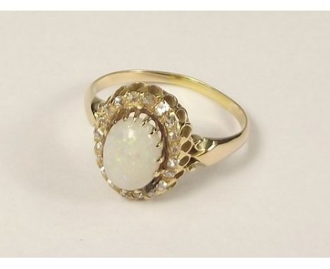 OPAL RING.
An opal & diamond cluster ring.
Size X.