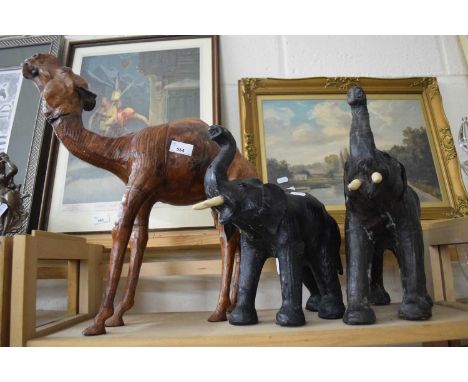 Leather model of a camel together with two of elephants