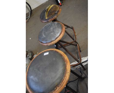 A pair of vintage bar stools and another similar
