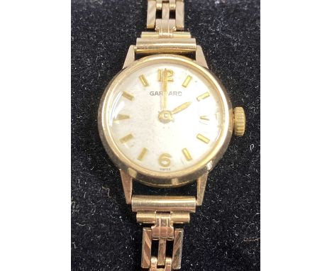 GARRARD 9CT GOLD LADIES' WRISTWATCH, 18mms dial on 9ct gold bracelet, with safety chain, 13.7gms grossProvenance: private col