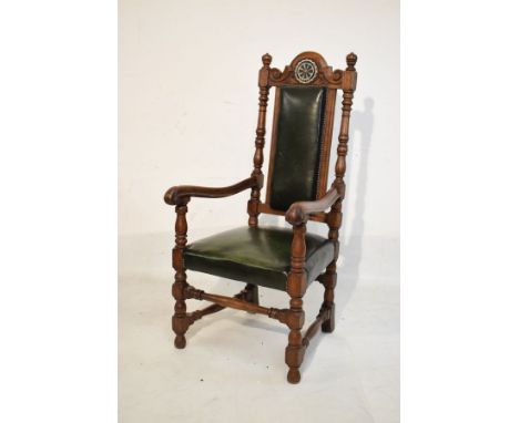 Large early 20th Century oak elbow chair, the carved crest rail bearing the emblem of the Rotary Club, Bristol, padded seat a