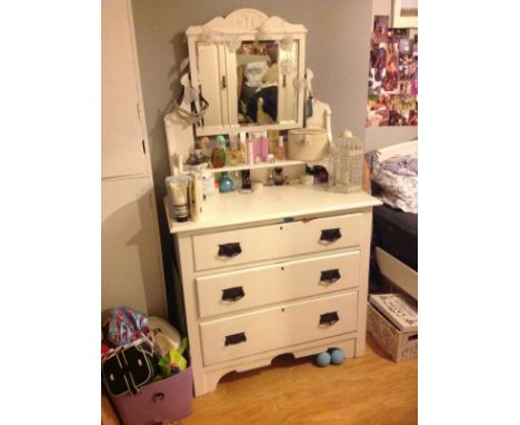 Edwardian white painted dressing chest, the raised back fitted swing mirror and open shelf, the base fitted three long drawer