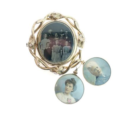 Gilt metal oval mourning brooch, the front panel housing a family photograph, the reverse with lock of hair, together with tw
