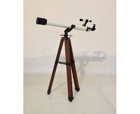 Prinz Optics astronomical telescope, model 330, on a wooden tripod base   Condition: 