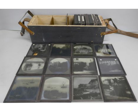 A box of 44 Victorian and Edwardian lantern slides, includes beach scenes, street scenes, motor car workshop, carpentry works