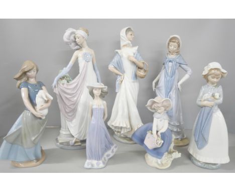 A collection of seven NAO and Lladro porcelain figures of various sizes (one significantly broken and repaired). Largest meas