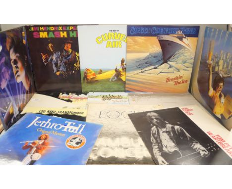 A collection of twelve heavy rock LP vinyl records including Led Zeppelin, Genesis, Jimi Hendrix, Billy Idol, Lou Reed and ot