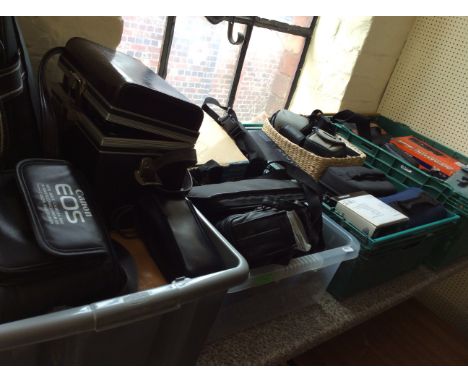 Four boxes of various cameras and camera equipment.