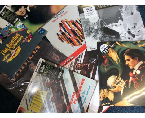 A box of various records to include Beatles albums, Pearl Jam, Nirvana etc.